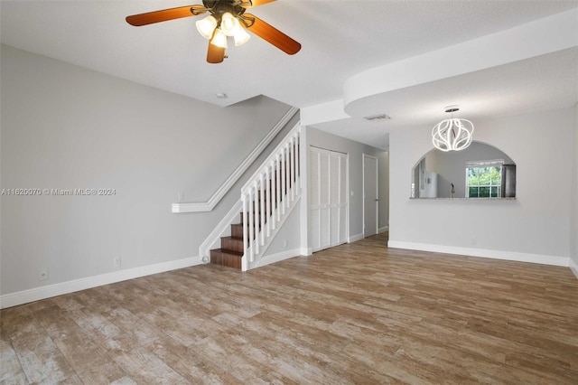 spare room with a textured ceiling, ceiling fan, and hardwood / wood-style floors