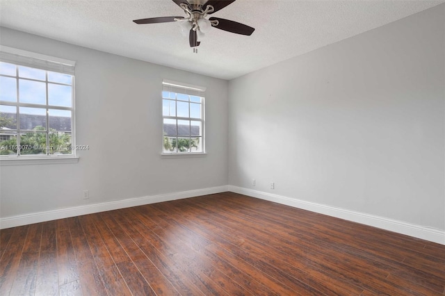 spare room with ceiling fan, wood-type flooring, and a textured ceiling