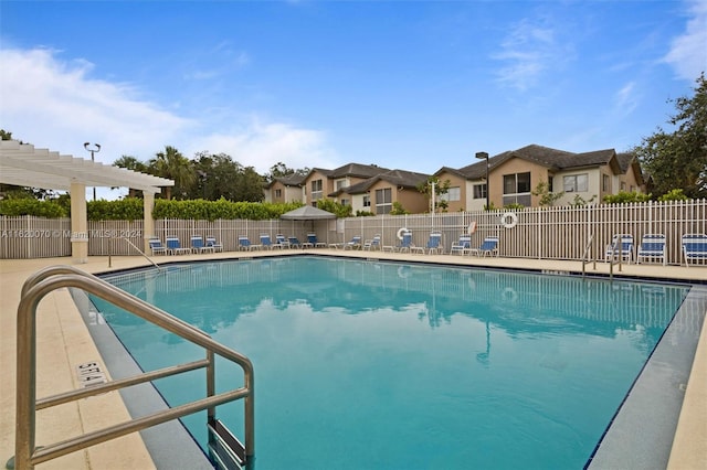 view of swimming pool featuring a pergola