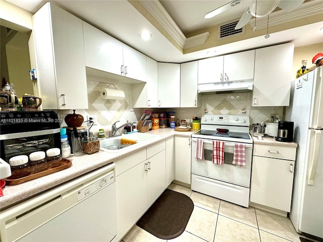 2831 Somerset Dr Unit 206, Lauderdale Lakes, FL 33311 - kitchen featuring a sink, tasteful backsplash, visible vents, white appliances, and under cabinet range hood