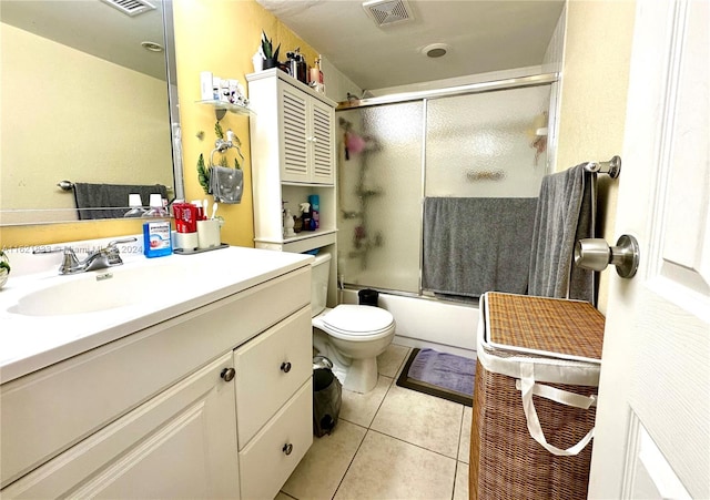 2831 Somerset Dr Unit 206, Lauderdale Lakes, FL 33311 - full bathroom featuring toilet, visible vents, tile patterned flooring, combined bath / shower with glass door, and vanity
