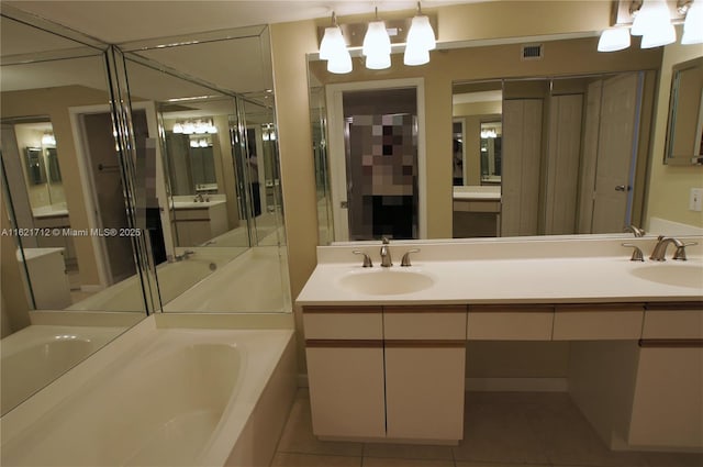 bathroom featuring tile patterned floors, vanity, and separate shower and tub