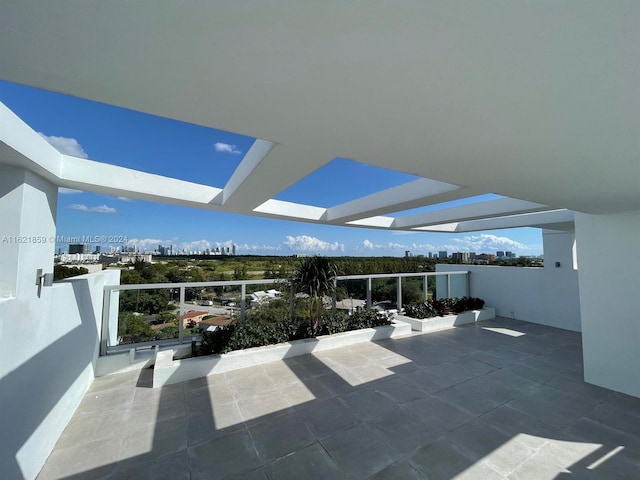 view of patio featuring a balcony