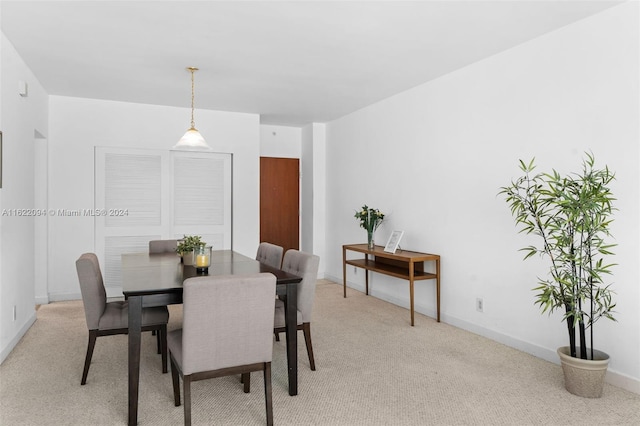 view of carpeted dining area