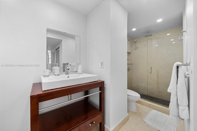 bathroom featuring vanity, walk in shower, tile patterned flooring, and toilet