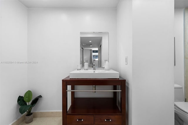 bathroom with toilet and vanity