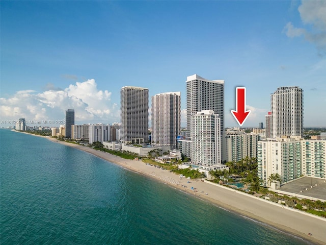 property's view of city with a water view and a view of the beach