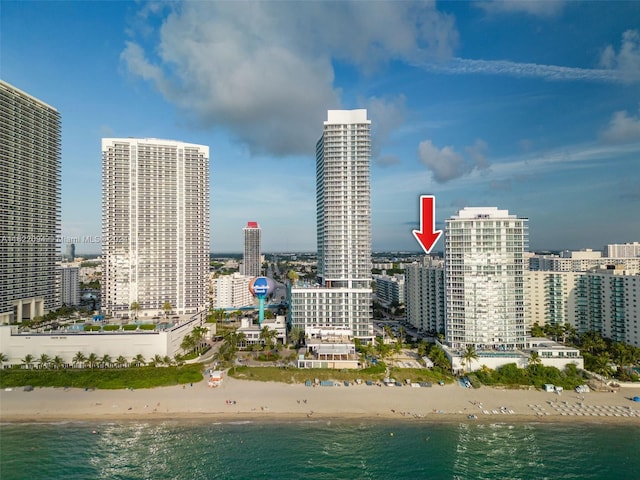 property's view of city featuring a view of the beach and a water view