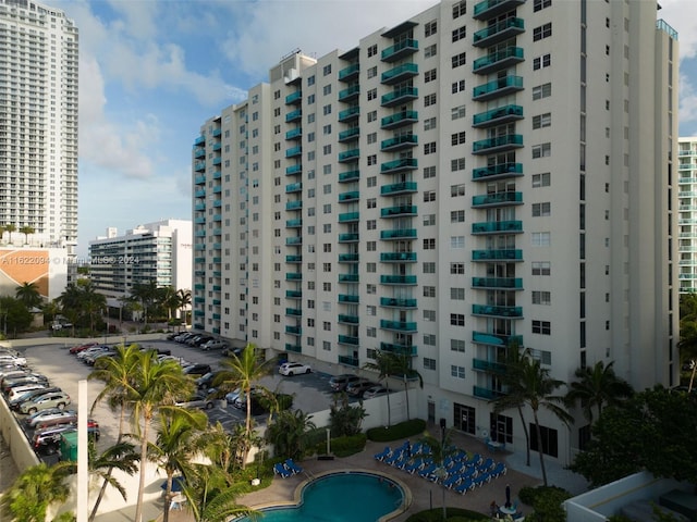 view of building exterior with a community pool