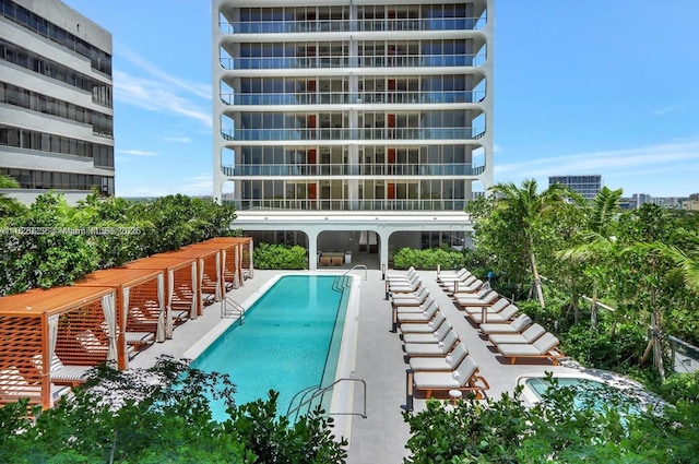 view of pool with a patio area and a pergola