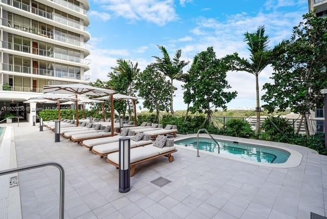 view of swimming pool featuring a patio area