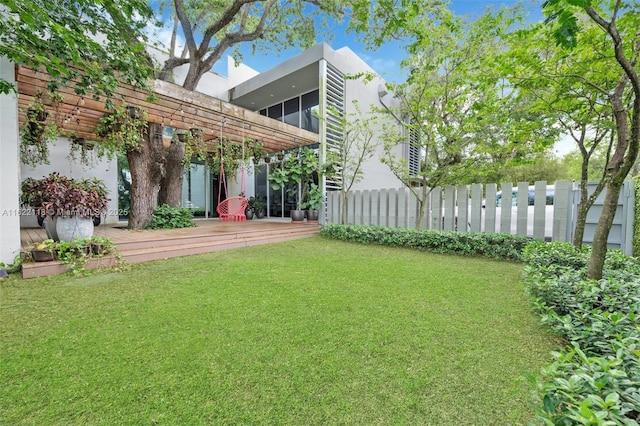 view of yard featuring a wooden deck