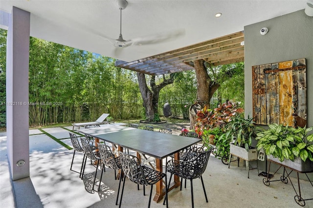 view of patio / terrace featuring ceiling fan and a pergola