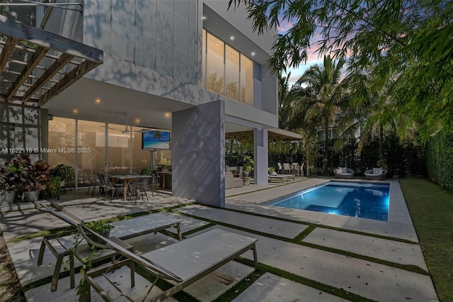 view of swimming pool featuring a patio area