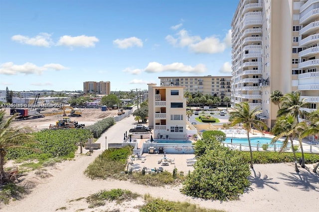 view of building exterior featuring a community pool