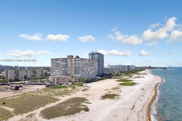 aerial view featuring a view of the beach and a water view