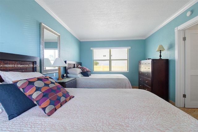 bedroom with crown molding and a textured ceiling