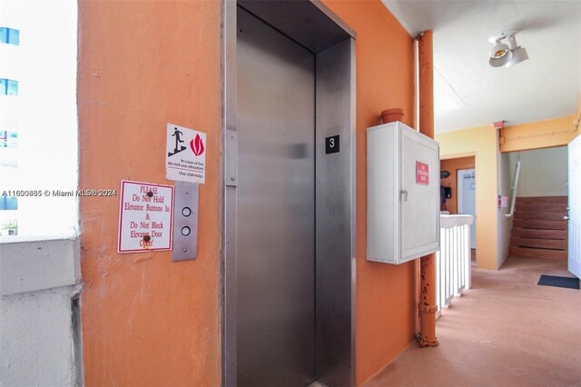 hallway featuring elevator