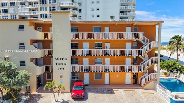 view of building exterior with a community pool