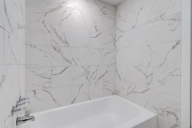 bathroom with a tub to relax in