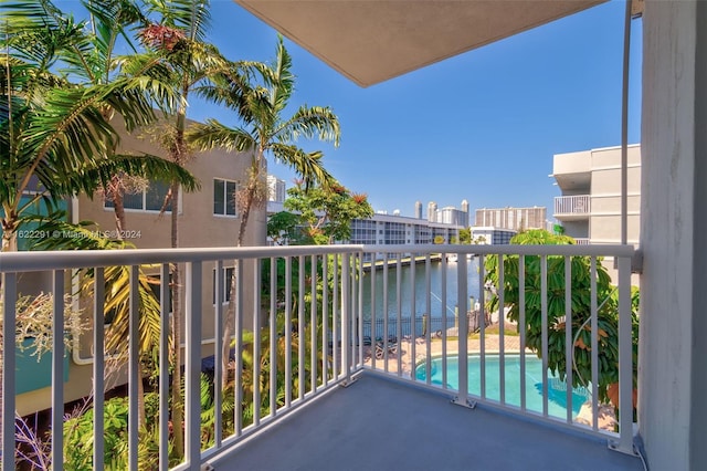 balcony featuring a water view