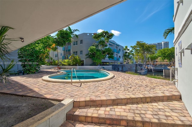 view of swimming pool with a patio area