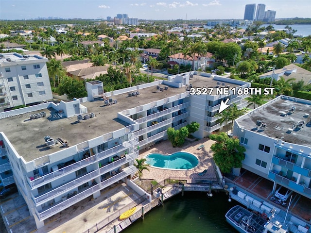 birds eye view of property with a water view