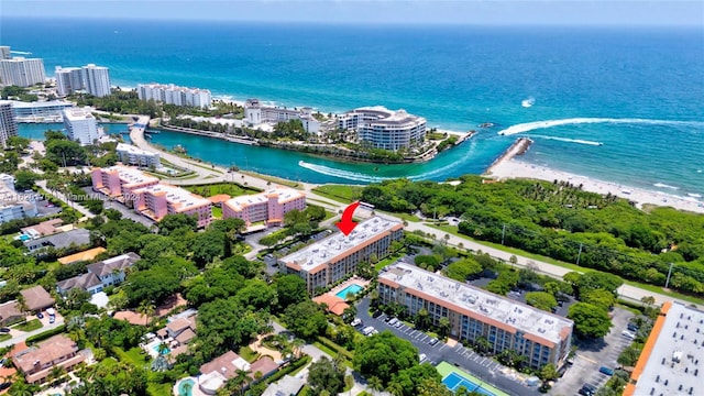 drone / aerial view with a water view and a view of the beach