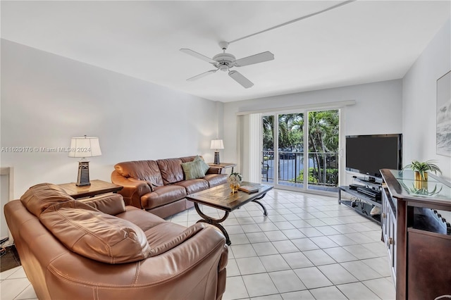 tiled living room with ceiling fan