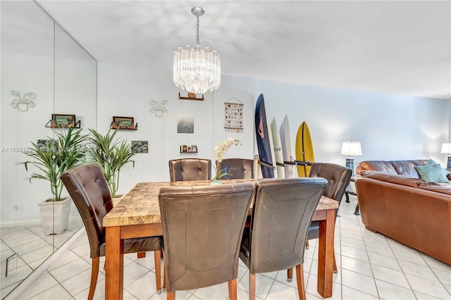 dining area featuring a notable chandelier and light tile patterned floors