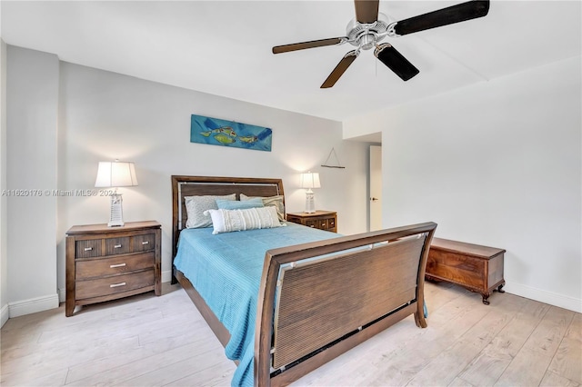 bedroom with ceiling fan and light hardwood / wood-style floors