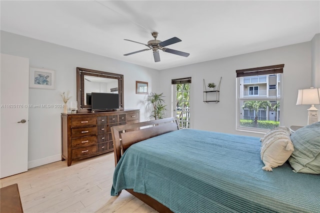 bedroom featuring ceiling fan and light hardwood / wood-style flooring