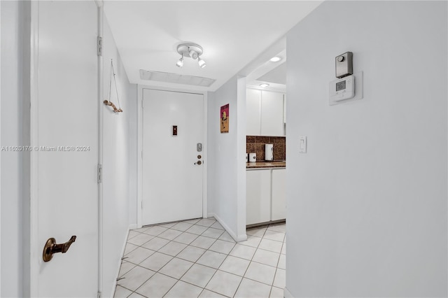 interior space featuring light tile patterned flooring