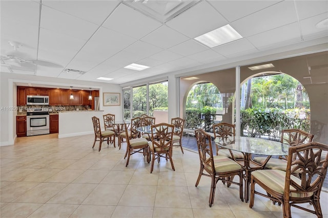 dining space featuring light tile patterned floors