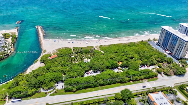 bird's eye view with a water view and a view of the beach