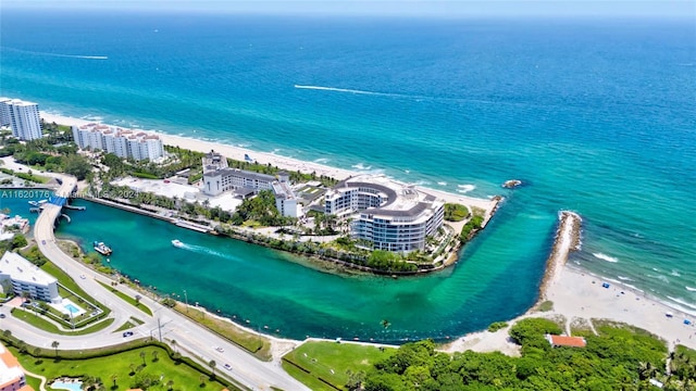 drone / aerial view featuring a water view and a beach view