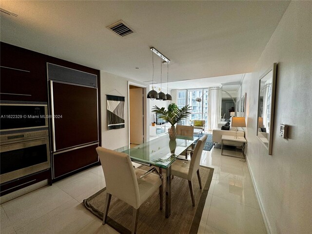 dining space with light tile patterned floors