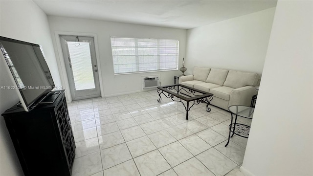 tiled living room featuring an AC wall unit