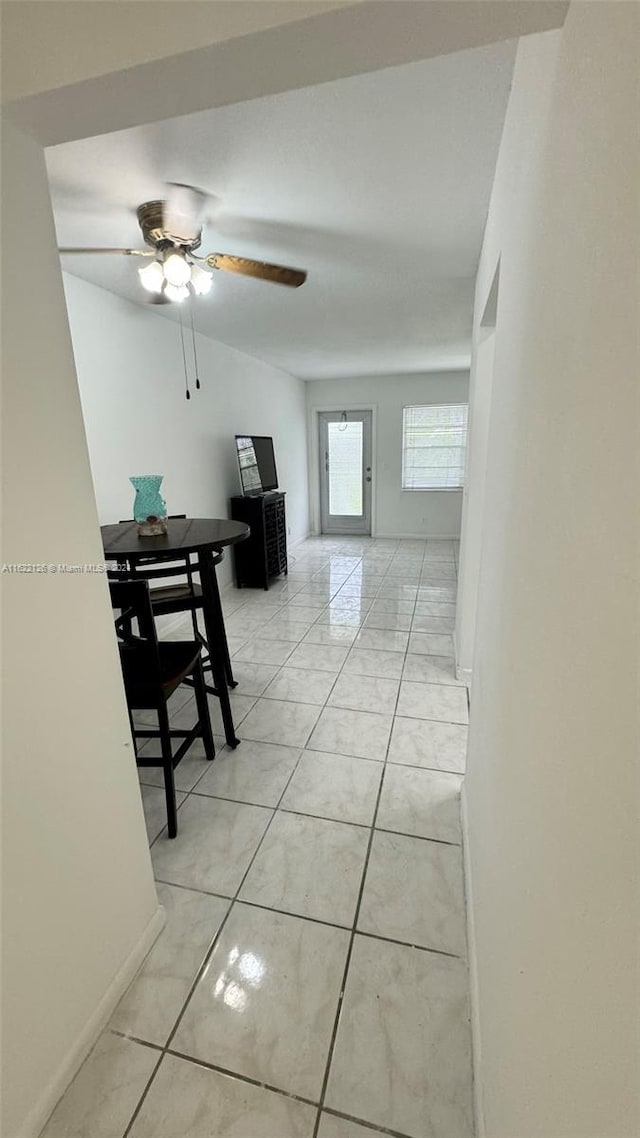 corridor featuring light tile patterned flooring