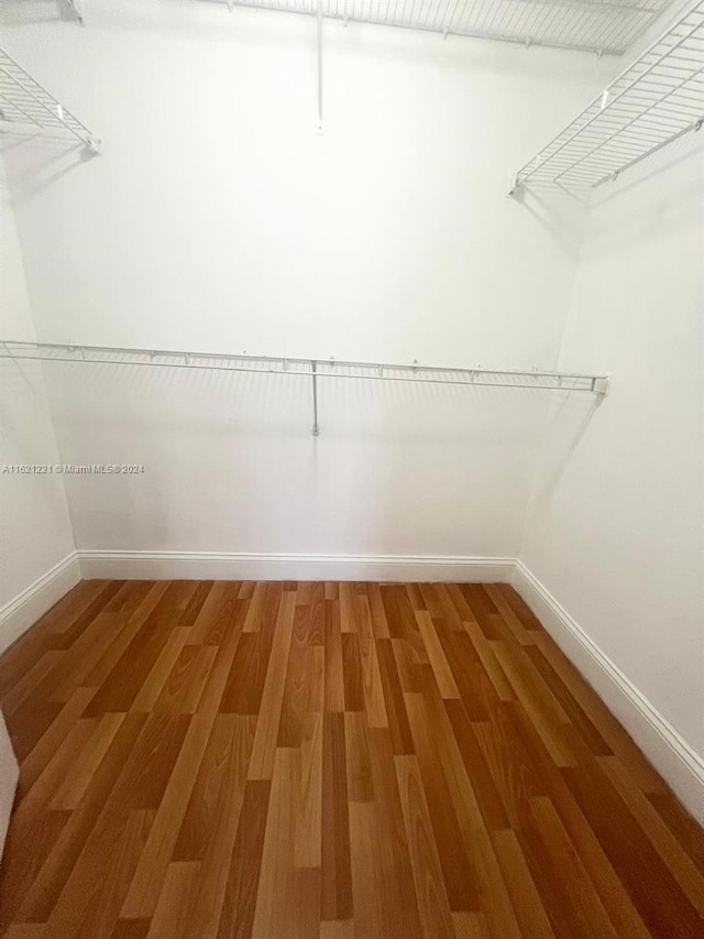 770 Claughton Island Dr Unit 406, Miami, FL 33131 - walk in closet featuring light wood-style flooring