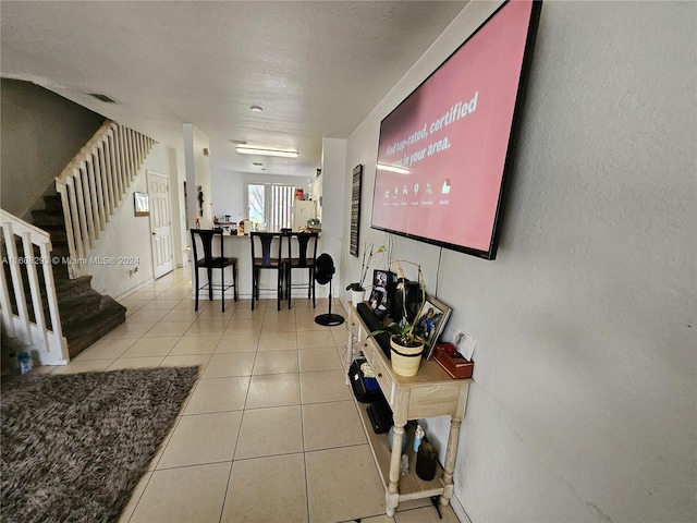 interior space with light tile patterned floors