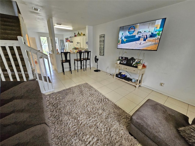 living room featuring light tile patterned flooring