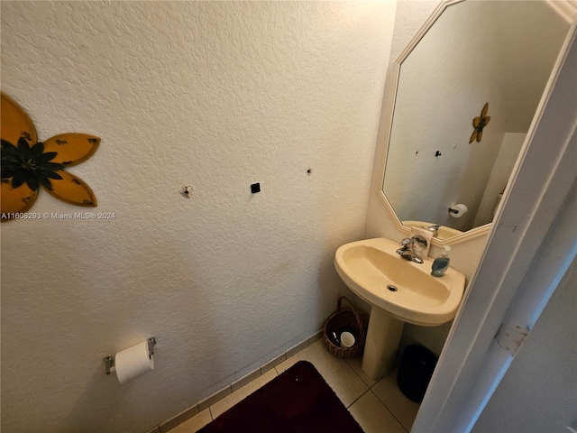 bathroom with tile patterned floors