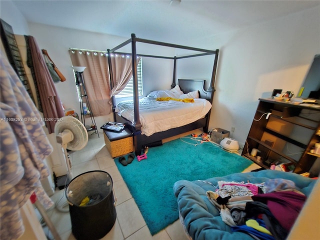 bedroom featuring light tile patterned floors