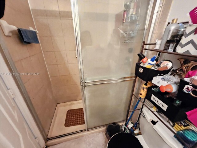 bathroom featuring an enclosed shower