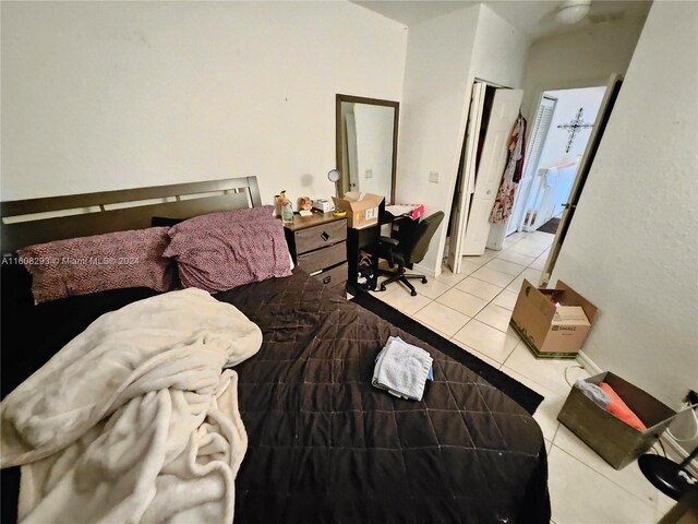 bedroom with light tile patterned floors