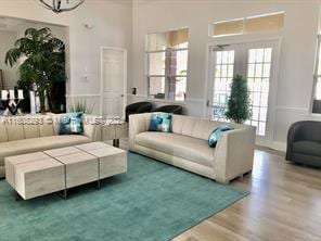 living room featuring hardwood / wood-style flooring and french doors