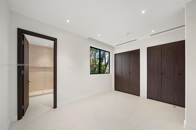 unfurnished bedroom with multiple closets