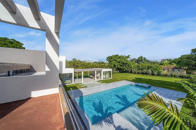 view of swimming pool with a patio and a yard