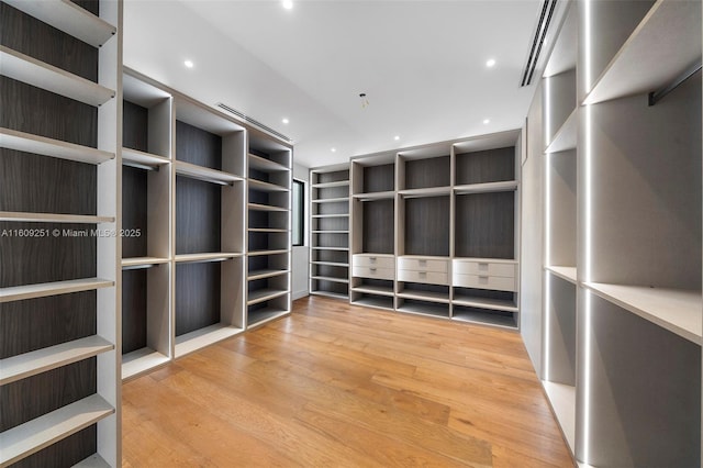 walk in closet featuring hardwood / wood-style floors